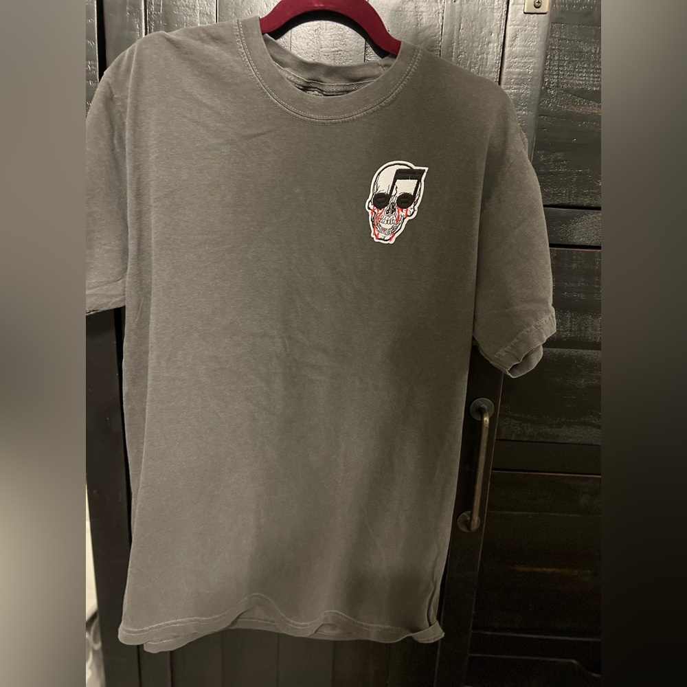 Size large, dark grey, comfort colors T-shirt with skull music emblem